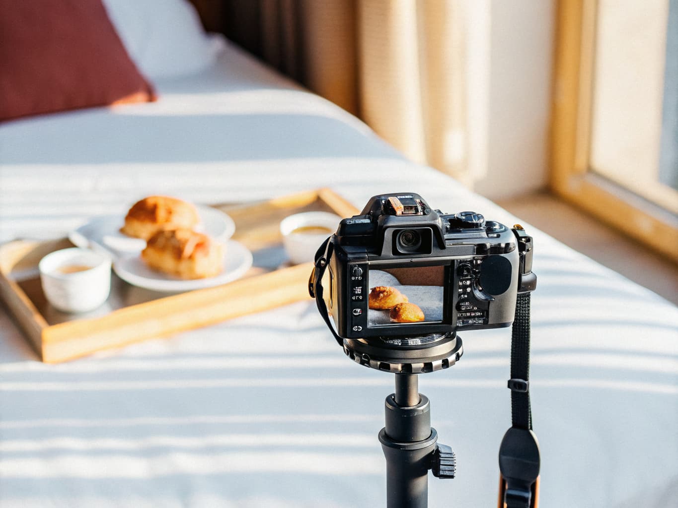 Bed and breakfast brand and visual storytelling: camera photographing a breakfast spread for content marketing