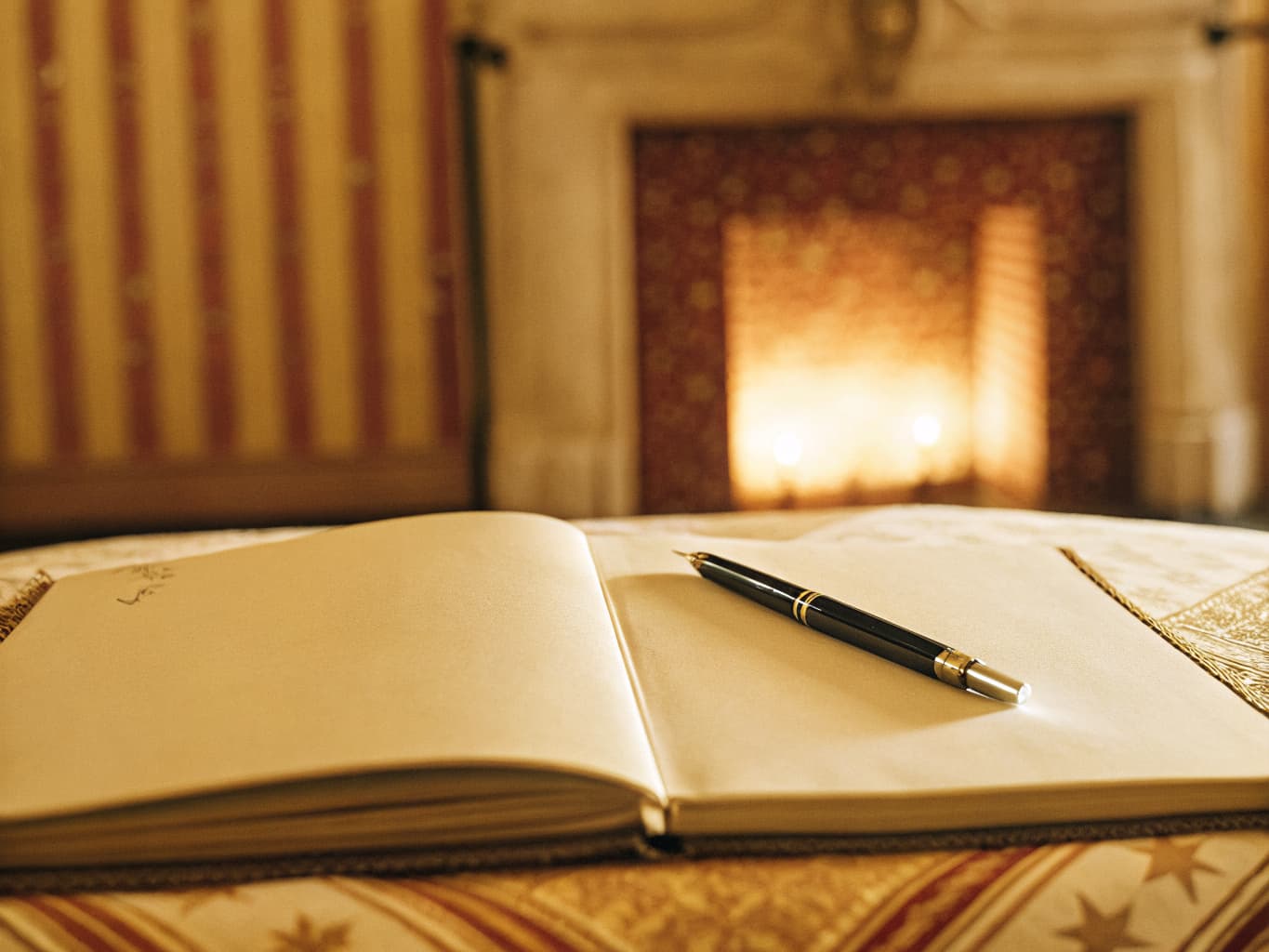 Bed and breakfast reputation and review management: guest book by a cozy fireplace