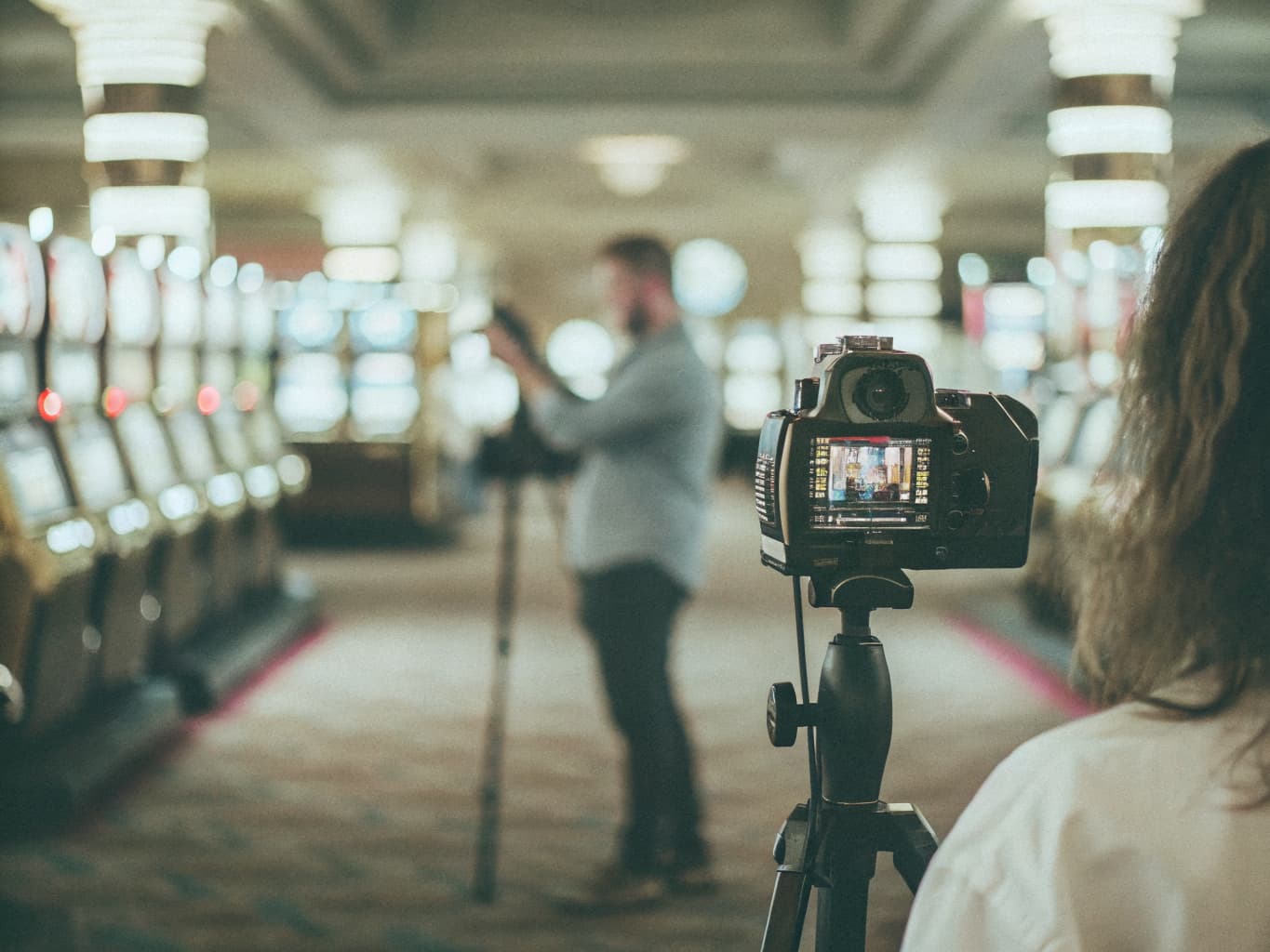 Casino brand and visual storytelling: photographer shooting a glowing casino gaming floor for marketing content