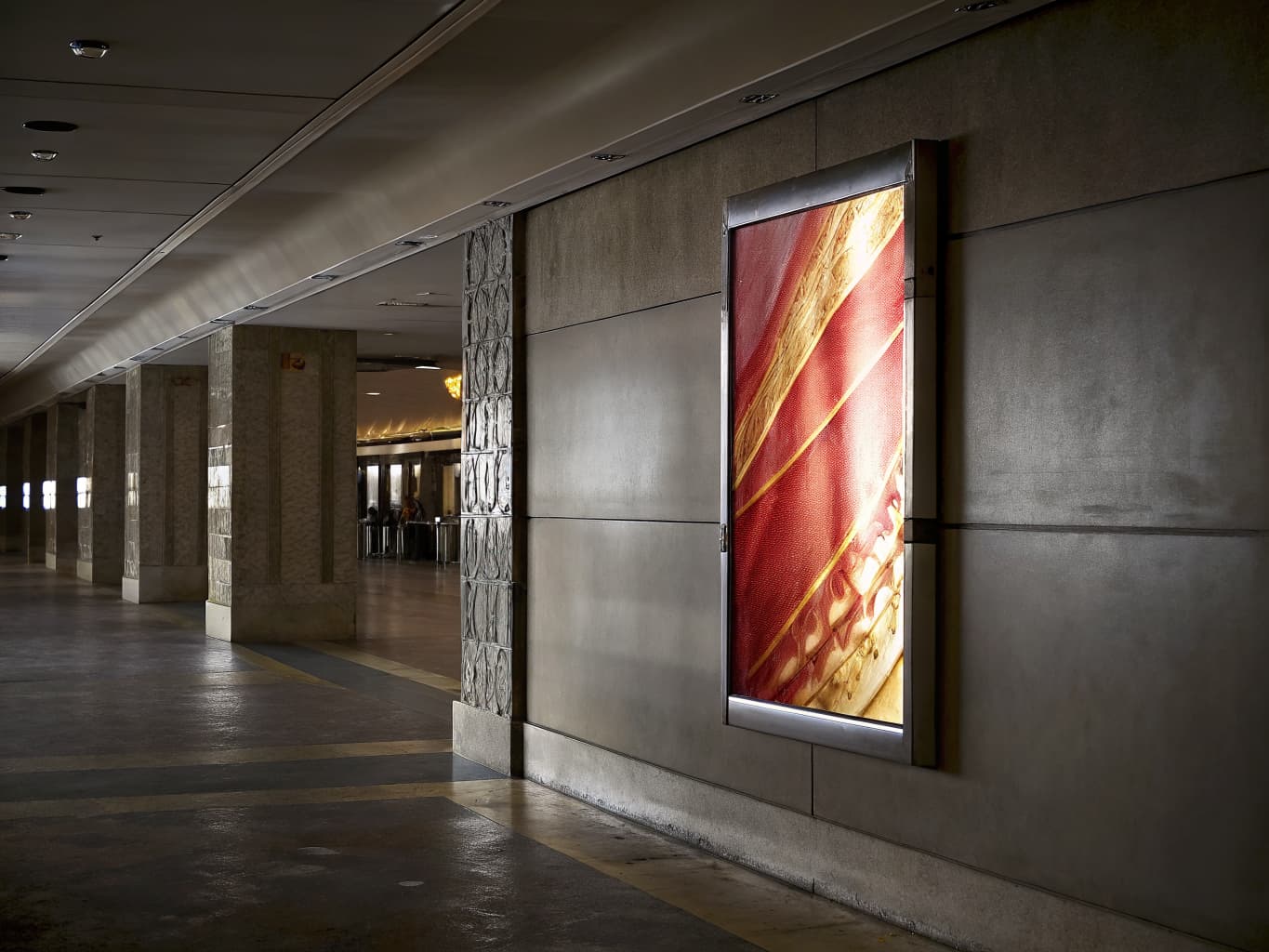 Casino paid media and remarketing campaigns: digital promotional display screen in a resort corridor
